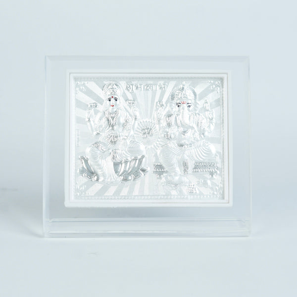 Close-up of silver Lakshmi Ganesh religious wall frame