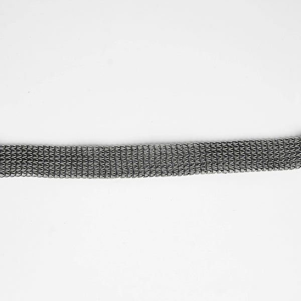 Silver oxidized tribal motif necklace worn on model
