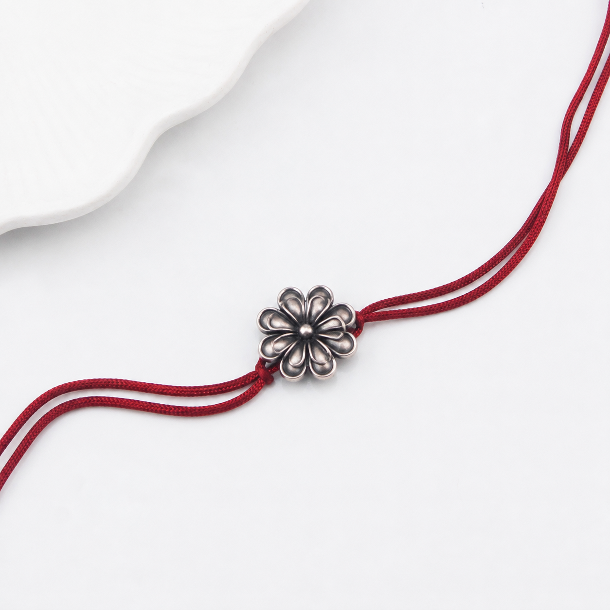 Handcrafted Silver Rakhi/Pendant: Double Flower