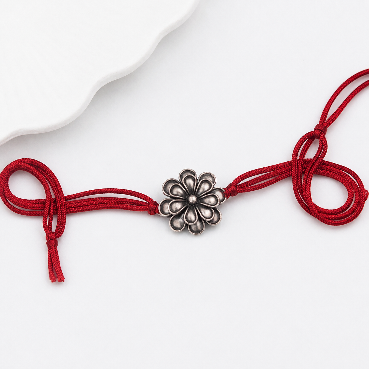 Handcrafted Silver Rakhi/Pendant: Double Flower