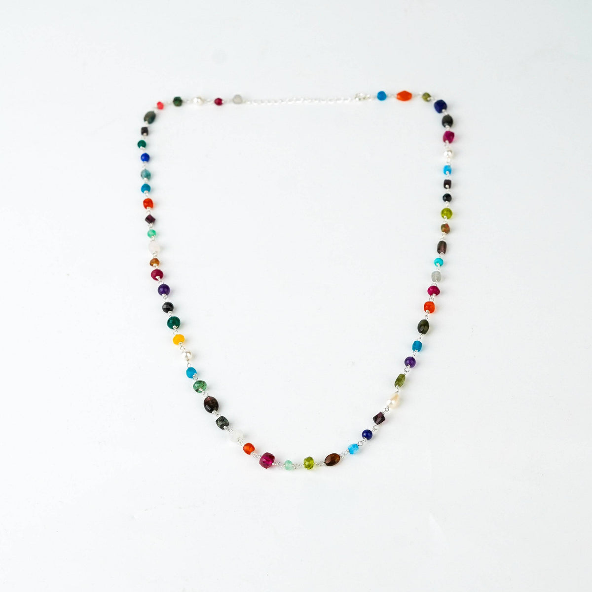 Detail shot of multicolour ganthan bead pattern in silver