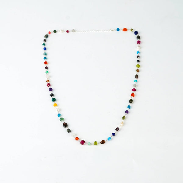 Detail shot of multicolour ganthan bead pattern in silver
