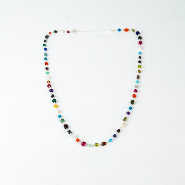 Detail shot of multicolour ganthan bead pattern in silver