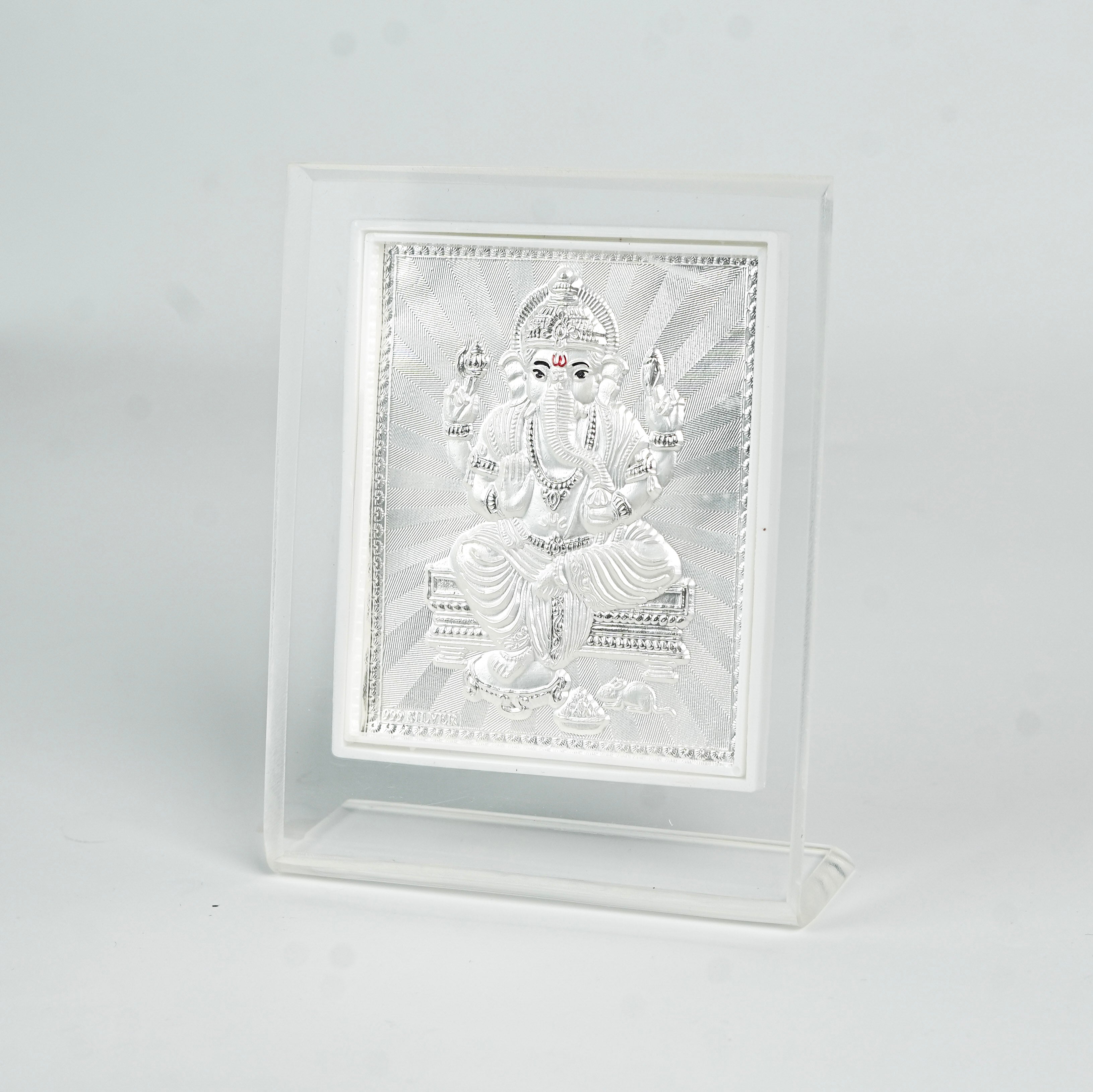 Close-up of Ganapati silver frame with detailed engraving for house decoration