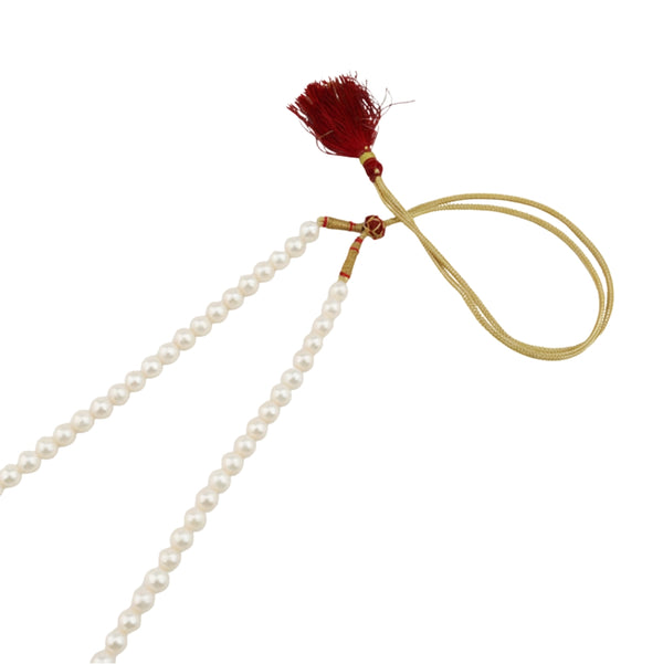 Pearl necklace with red tassel and gold cord
