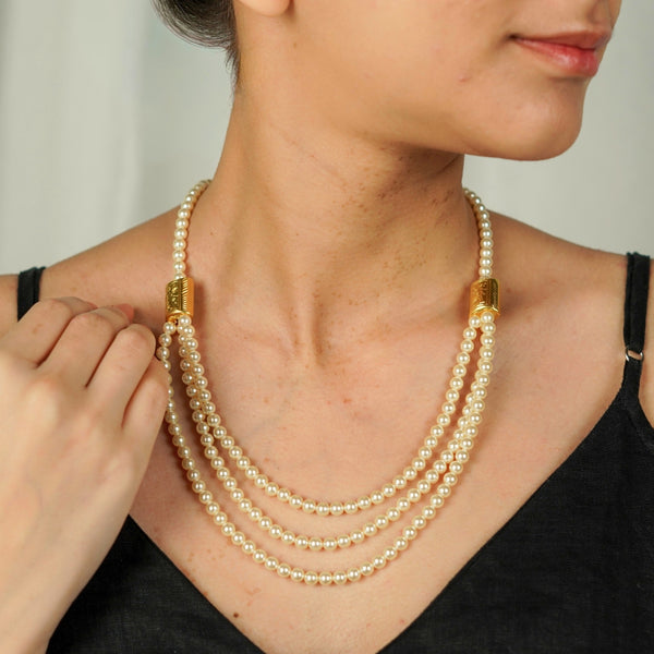 Close-up of 3 Layer Necklace with carved bead and pearl detailing