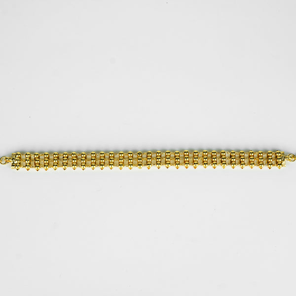 Close-up of gold plated beaded necklace