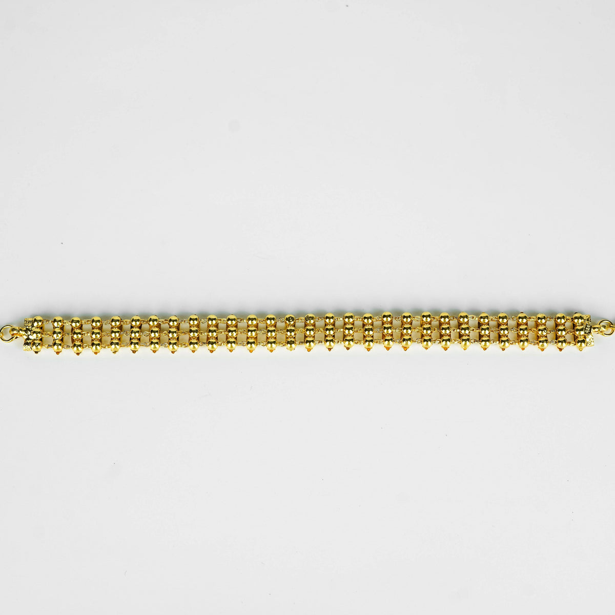 Close-up of gold plated beaded necklace