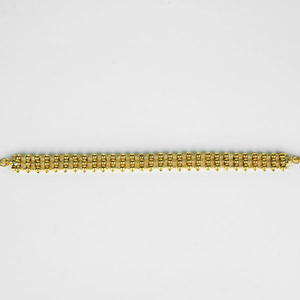 Close-up of gold plated beaded necklace