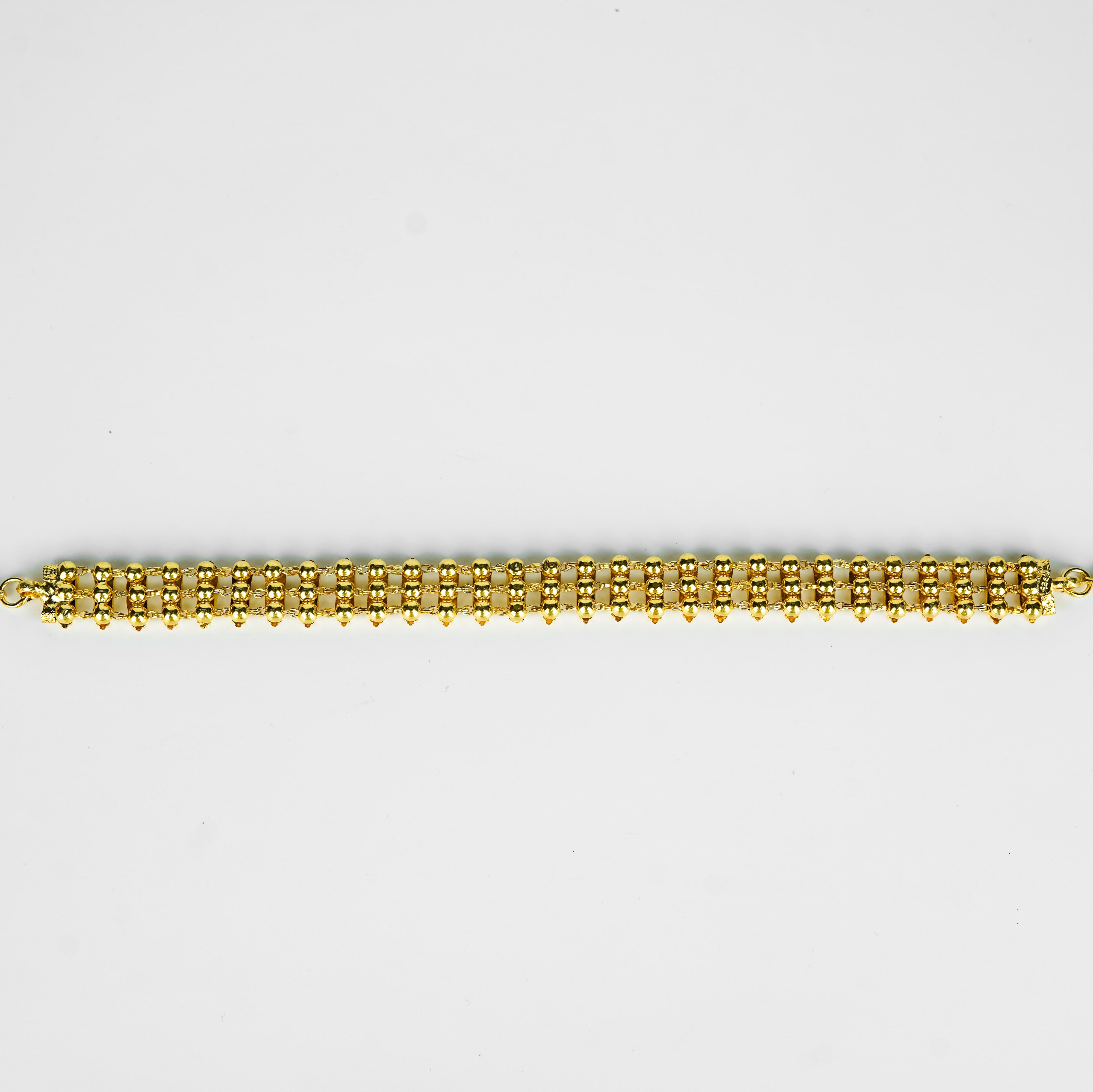 Close-up of gold plated beaded necklace