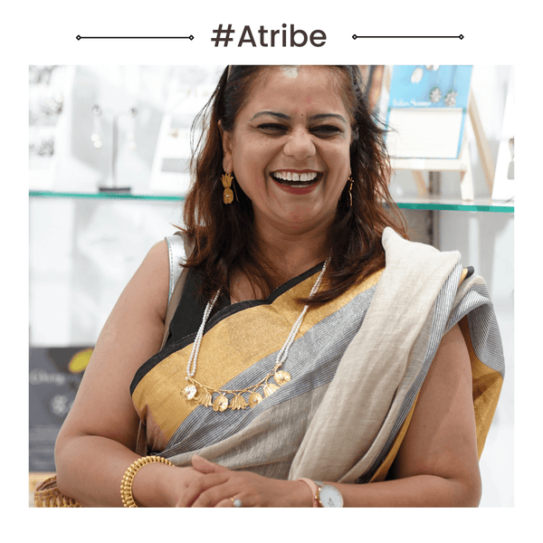 Happy woman wearing jewelry at jewelry store