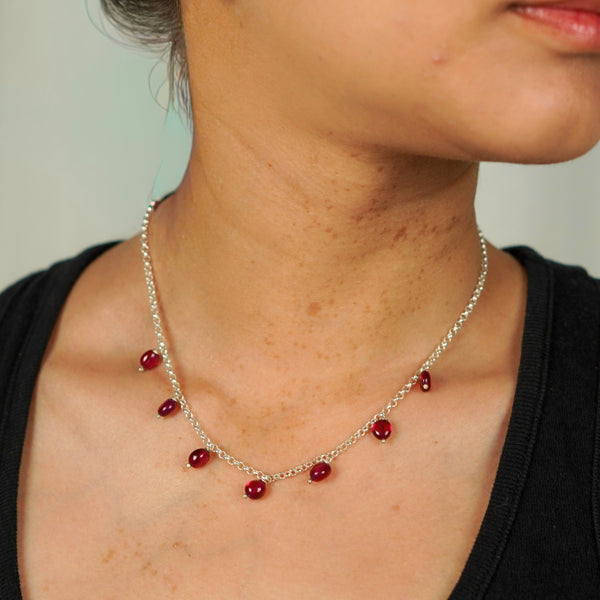 Model wearing Silver Ruby Chain necklace, elegant jewelry accessory