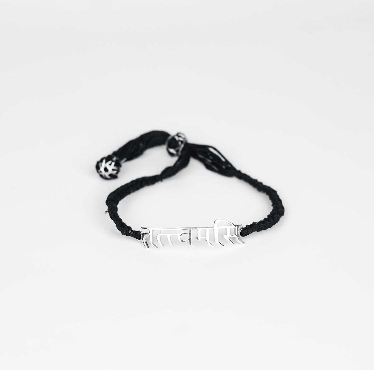 Close-up of Tatvamasi Mahavakya silver bracelet on white background
