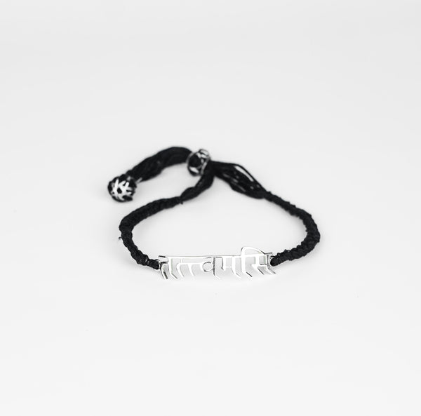 Close-up of Tatvamasi Mahavakya silver bracelet on white background