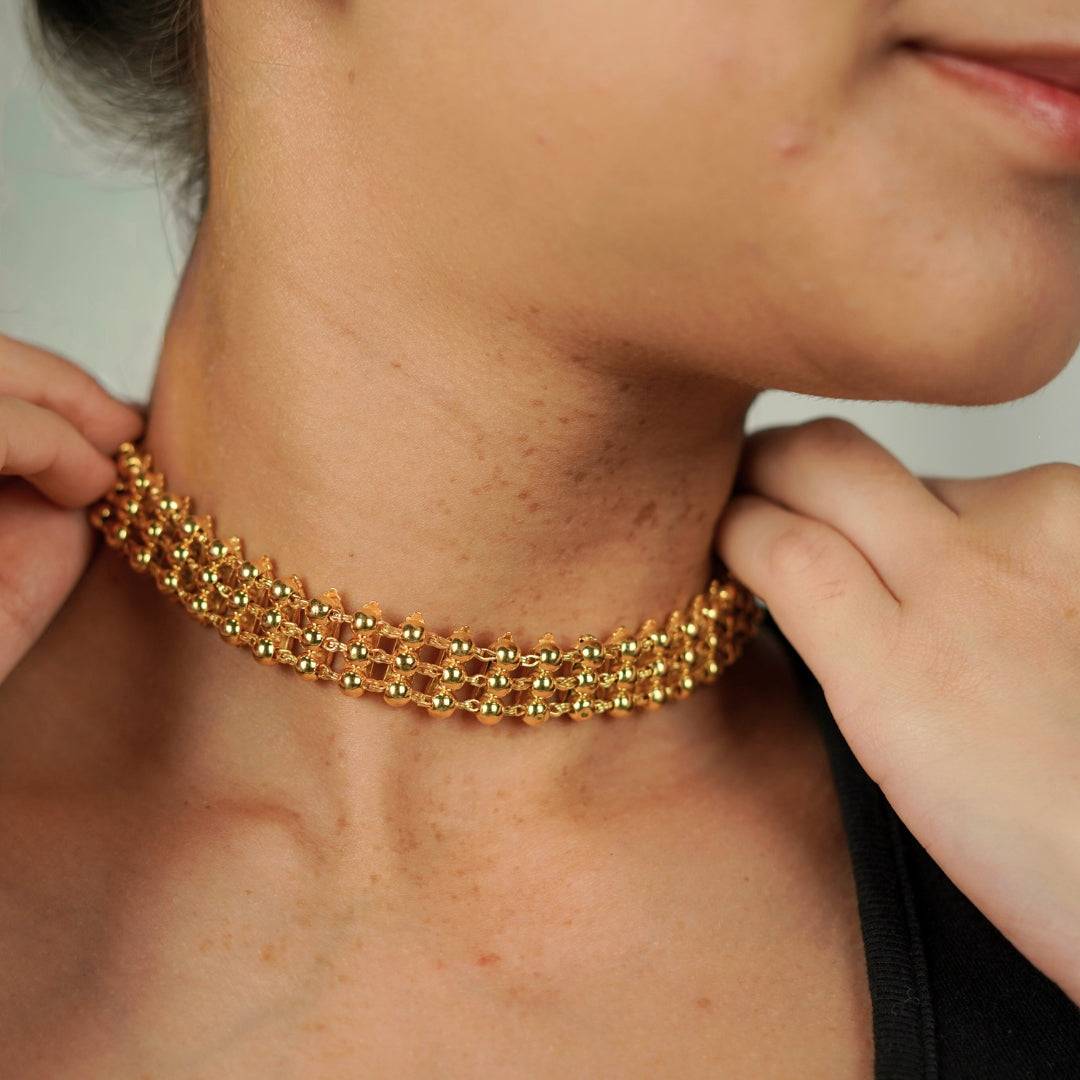 Model wearing gold silver two way choker