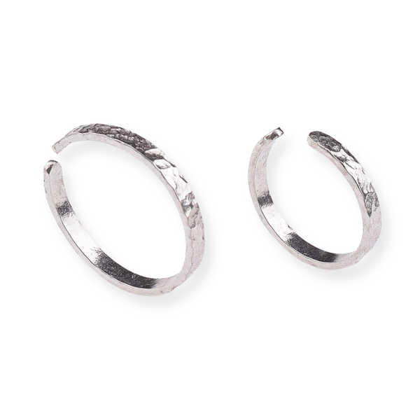 Hammered couple rings in silver for jewelry