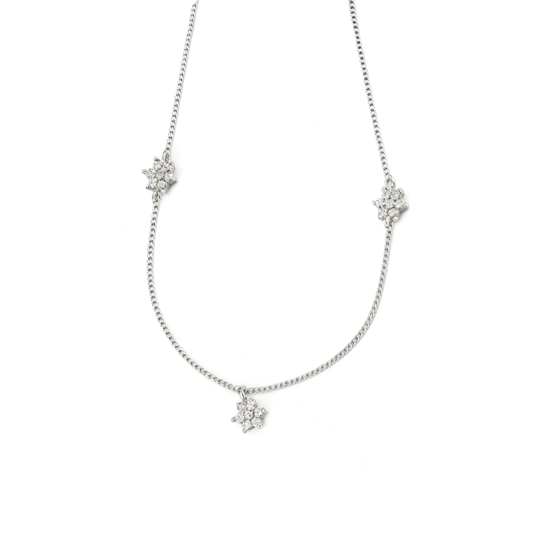 Silver CZ flower necklace with multi motifs on white background