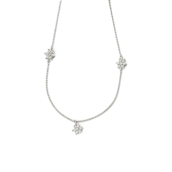 Silver CZ flower necklace with multi motifs on white background
