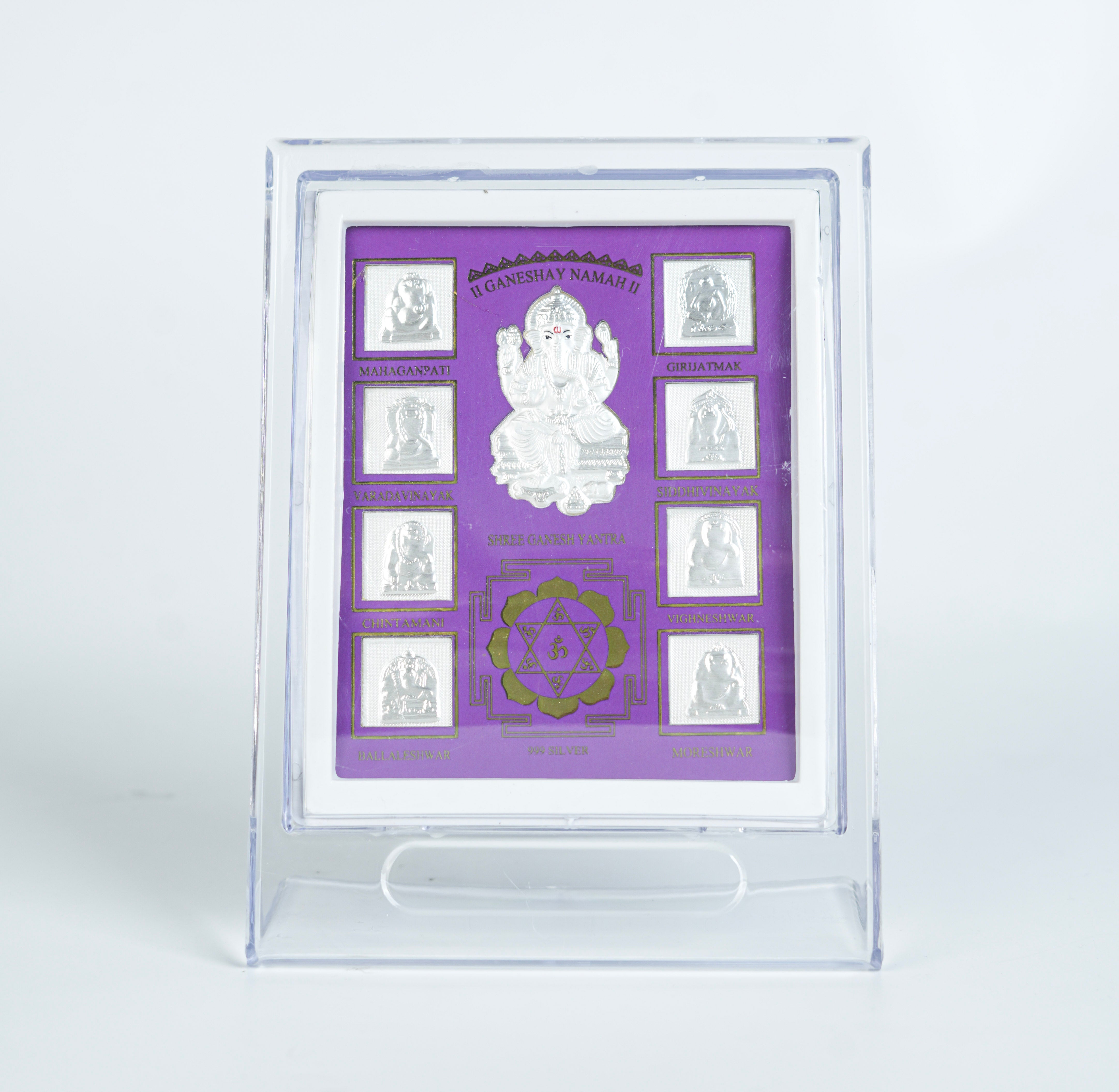 Silver Ganesh Yantra frame with purple background and detailed deity image for home decor