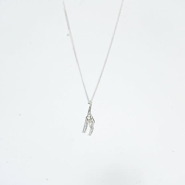 Close-up of silver giraffe pendant necklace