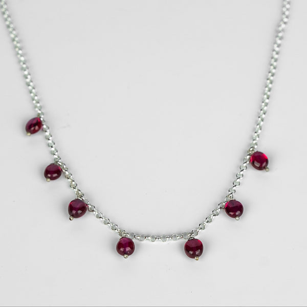 Close-up of Silver Ruby Chain with red gemstone accents, sterling silver jewelry for women