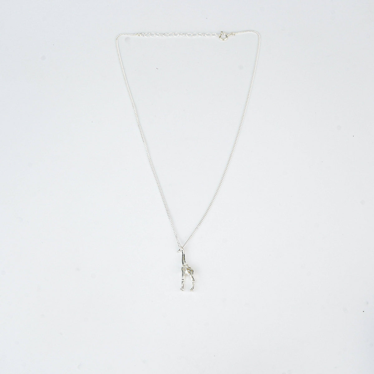 Silver giraffe pendant necklace on chain