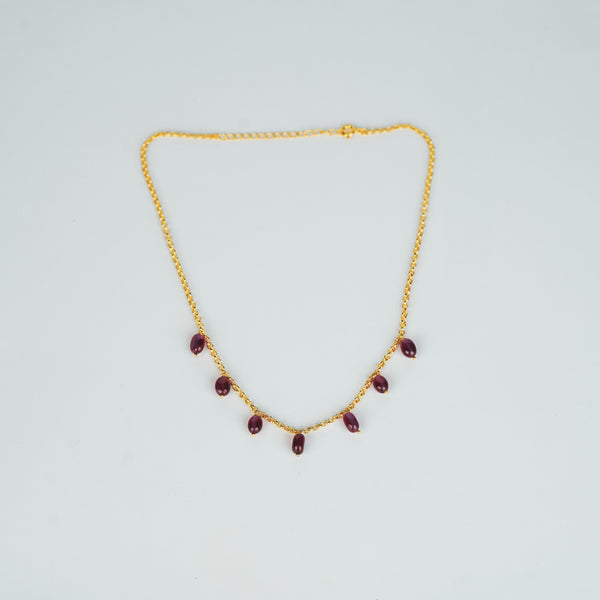 Gold chain with ruby beads