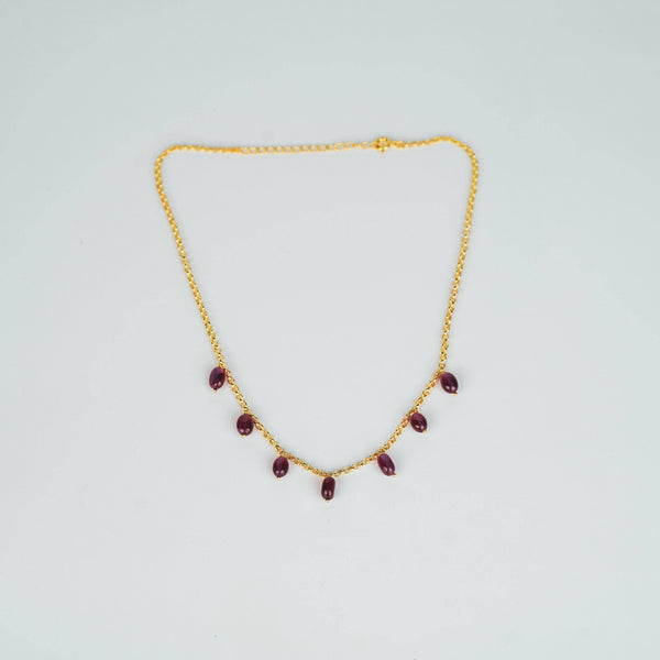 Gold chain with ruby beads