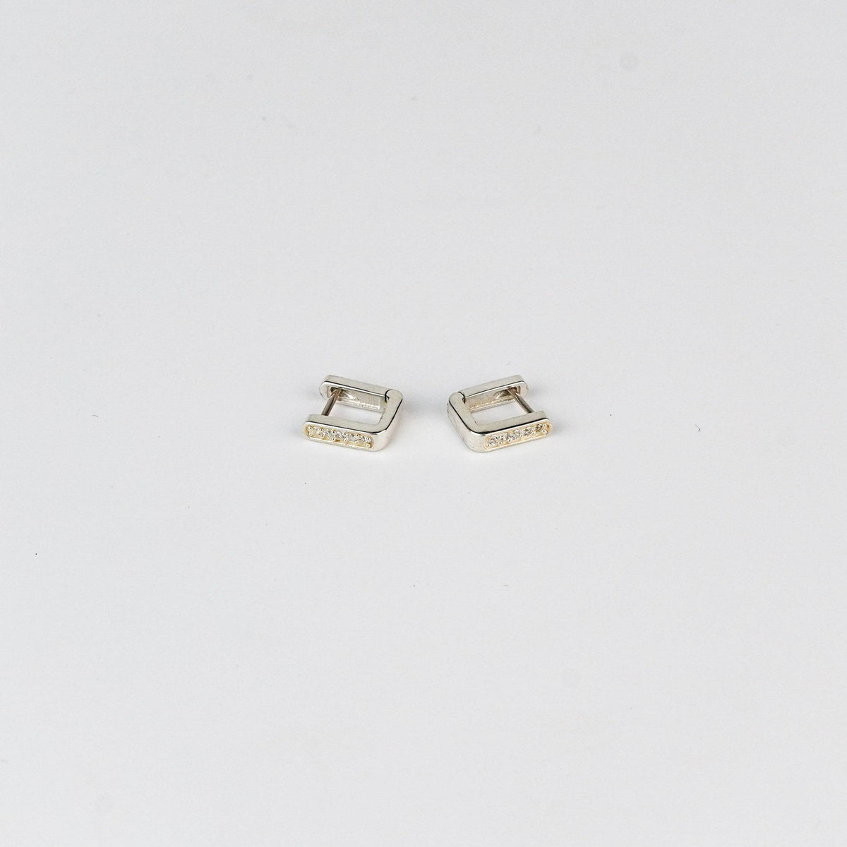Close-up of Silver CZ U Shape Earrings with Sparkling Stones