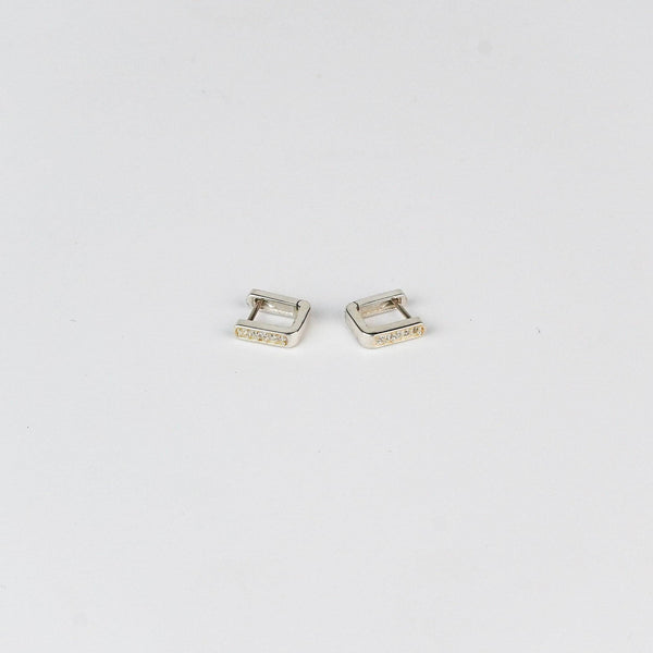 Close-up of Silver CZ U Shape Earrings with Sparkling Stones