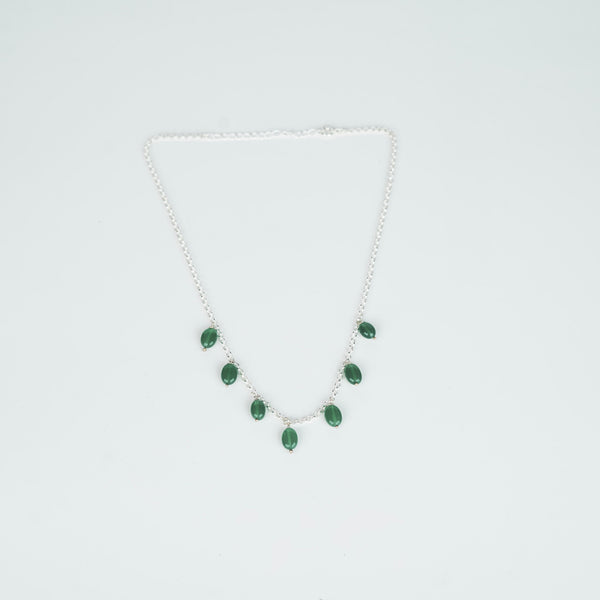 Detail shot of green onyx setting in silver chain