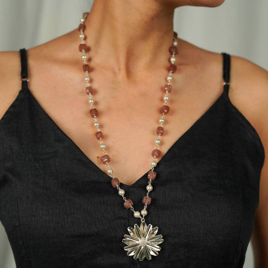 Angled view of Silver Soorajmukhi Pendant Pink Strawberry Cubes