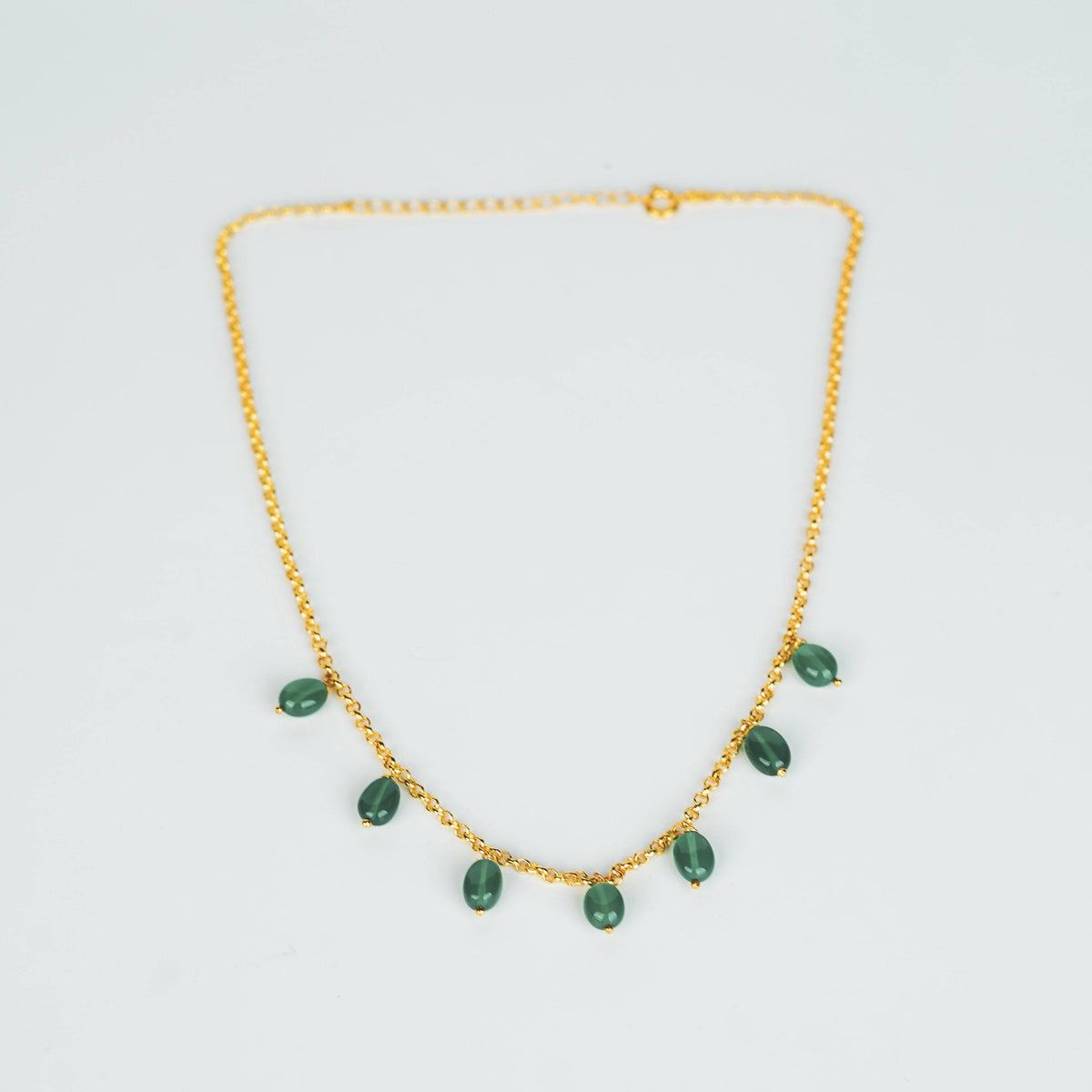 Gold chain with green onyx pendants