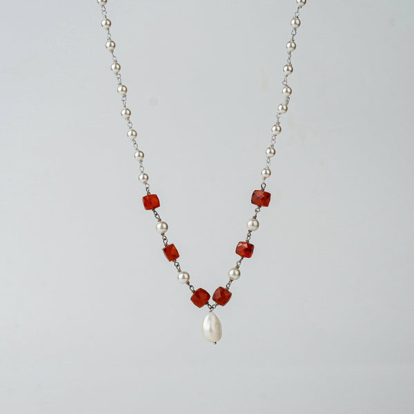 Angled side view of Pearl Ganthan Necklace with stones
