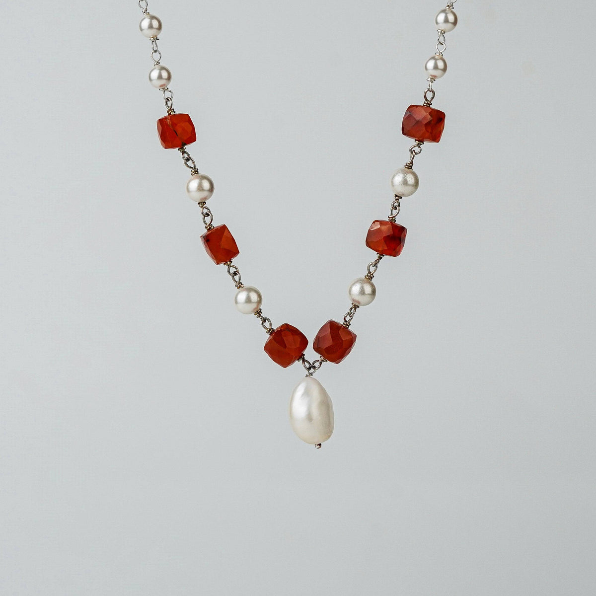 Detail shot of pearl ganthan pattern and stone accents