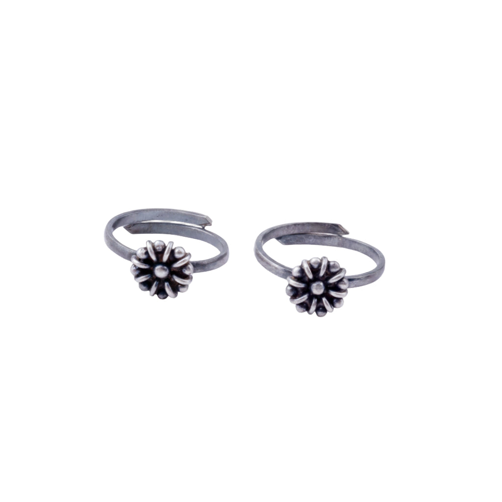 Tiny silver adjustable flower toe ring in 92.5 sterling silver front view