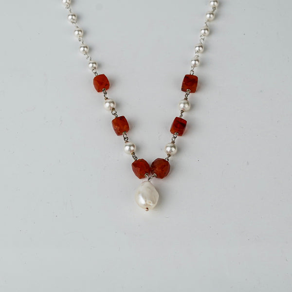 Woman styling Pearl Ganthan Necklace with festive outfit
