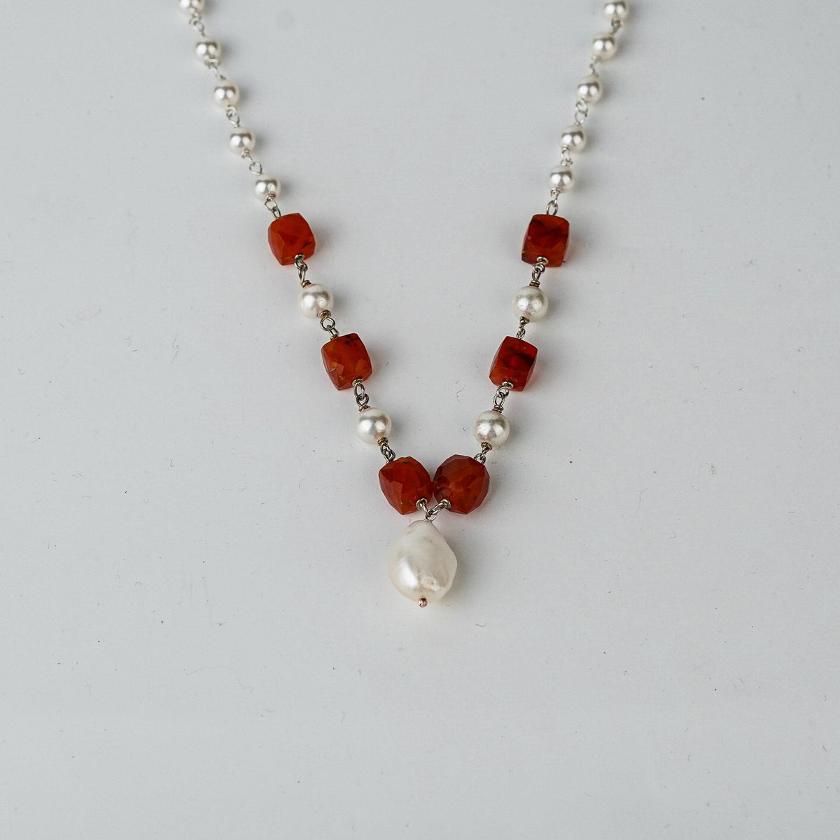 Woman styling Pearl Ganthan Necklace with festive outfit