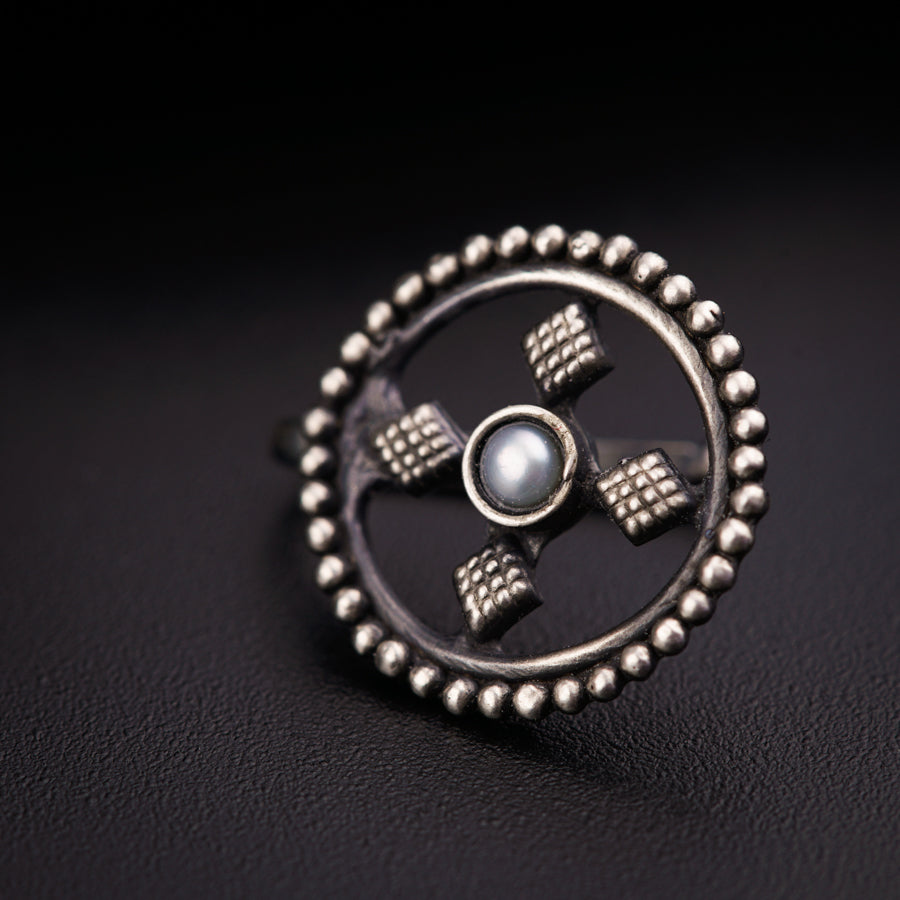 a close up of a ring on a black surface