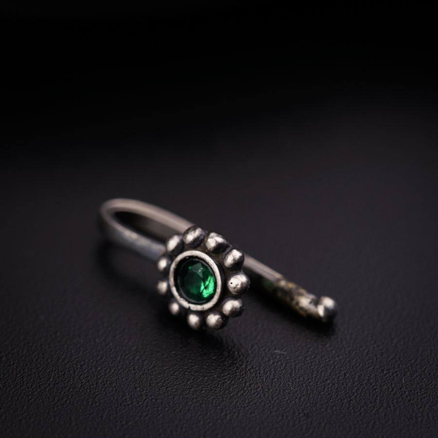 a close up of a ring on a black surface