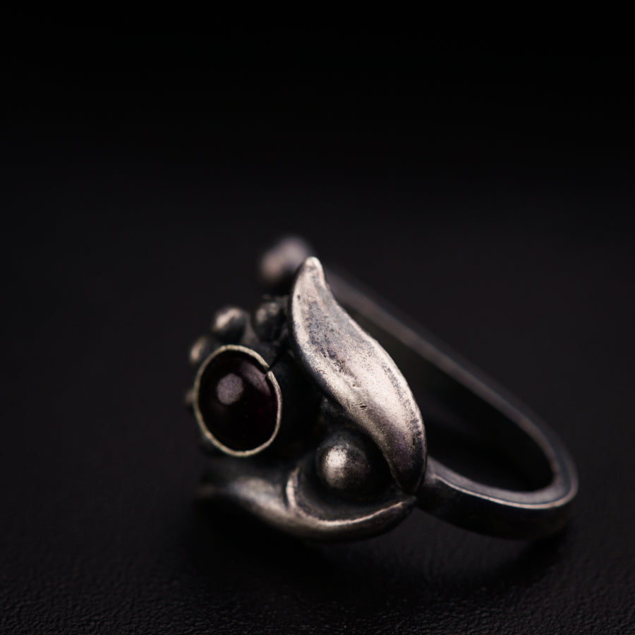 a close up of a ring on a black surface