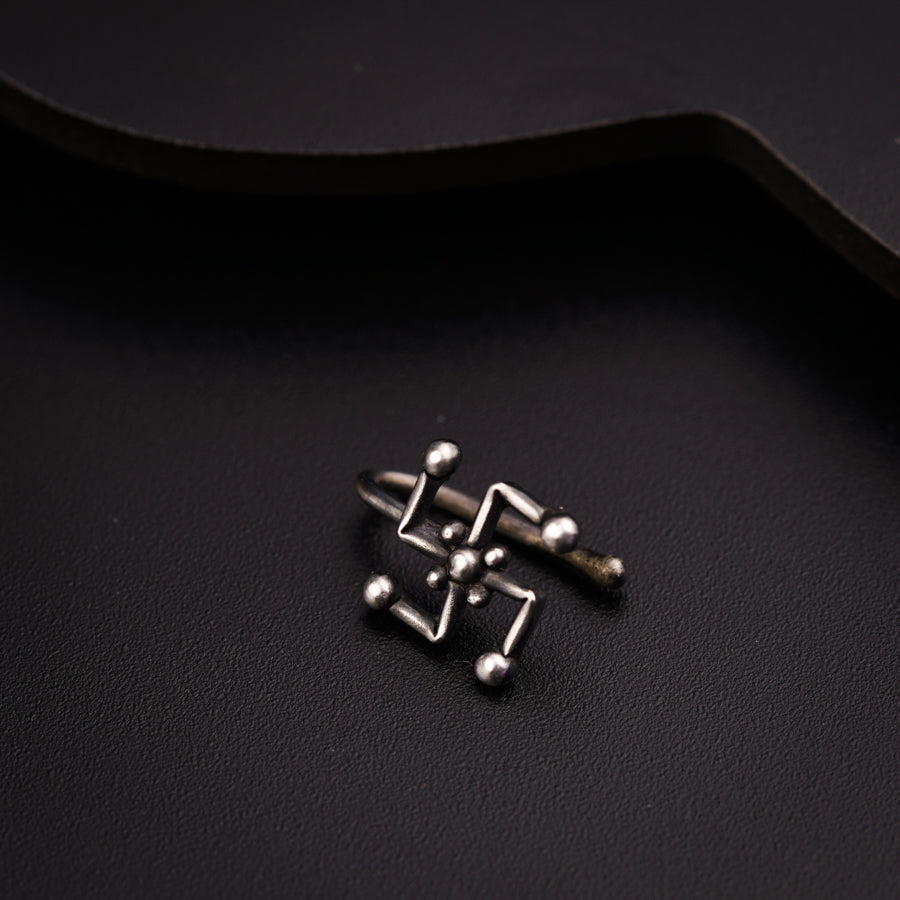 a close up of a metal object on a black surface