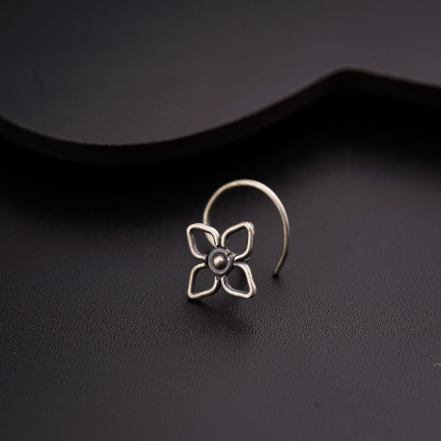 a close up of a pair of earrings on a table