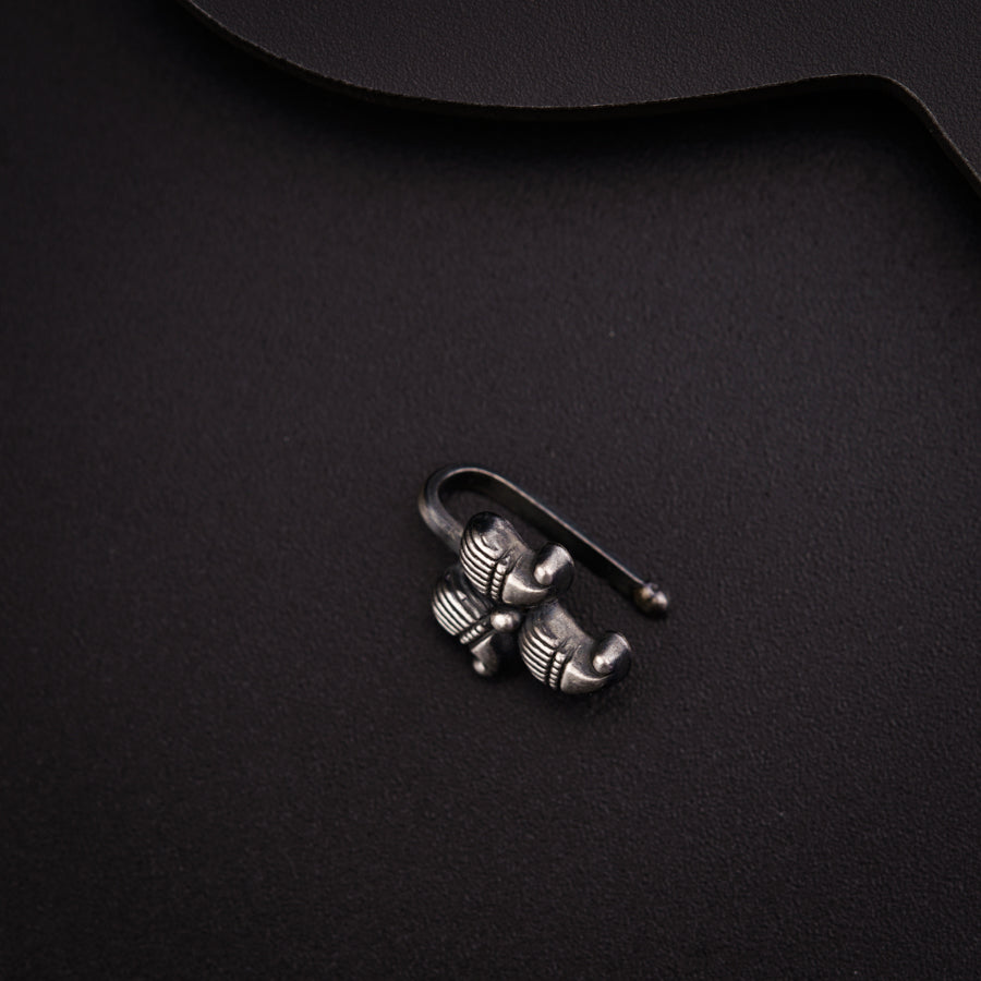 a black table with a pair of metal hooks