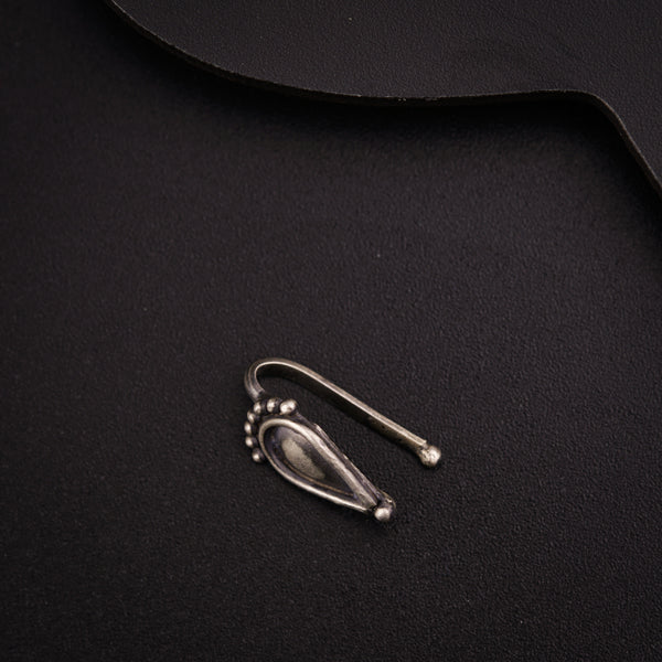 a pair of scissors sitting on top of a black cloth