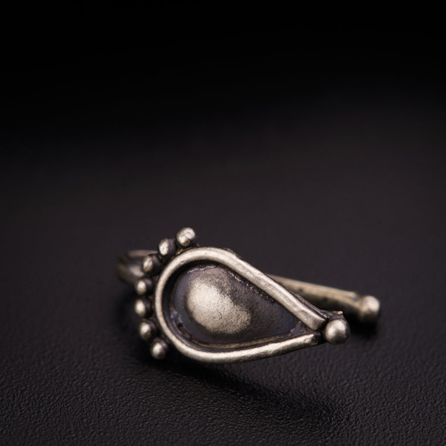 a close up of a ring on a black surface