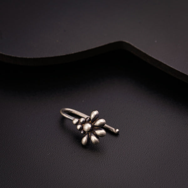 a close up of a ring on a black surface