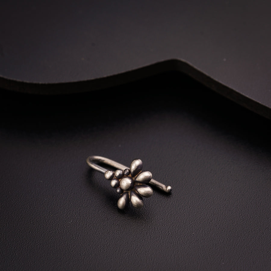 a close up of a ring on a black surface