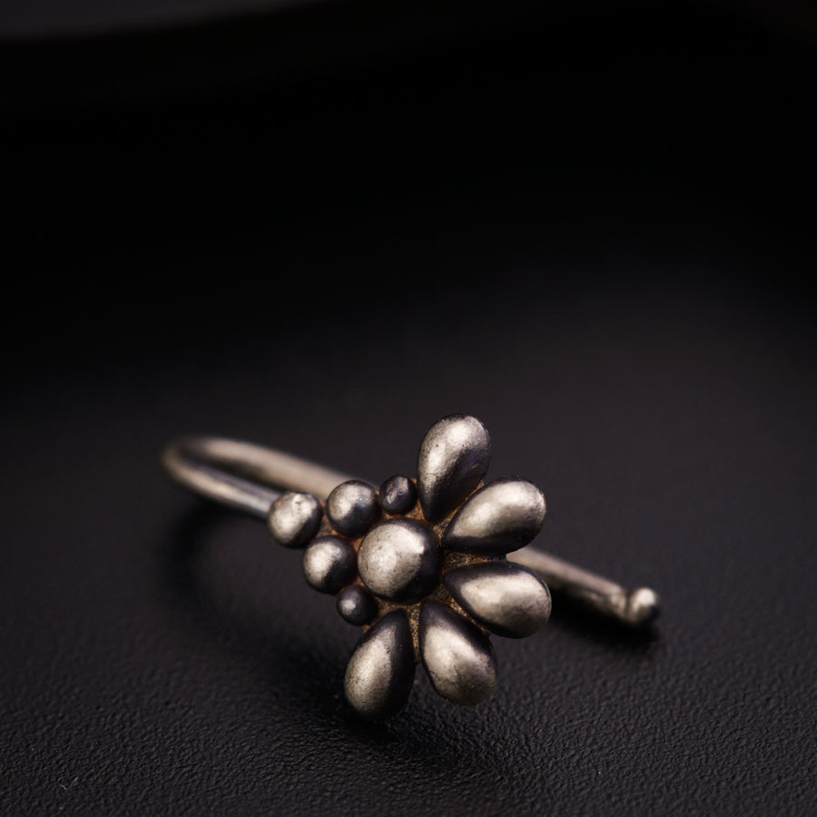 a close up of a ring on a black surface