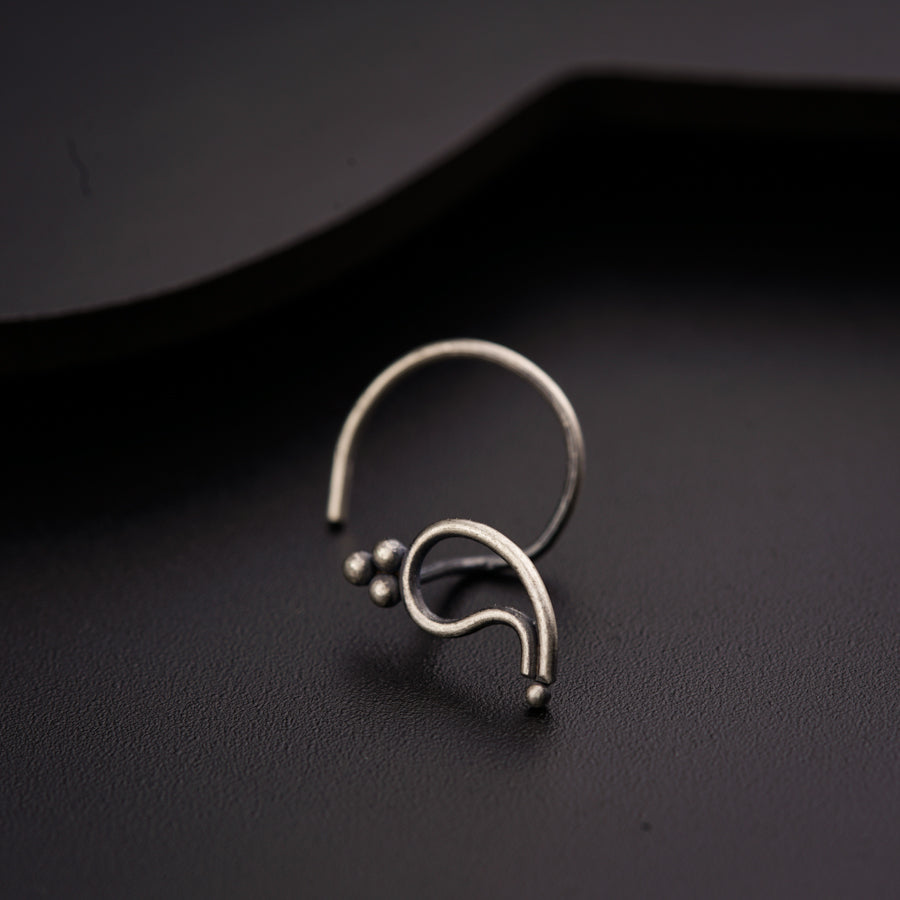 a close up of a ring on a black surface